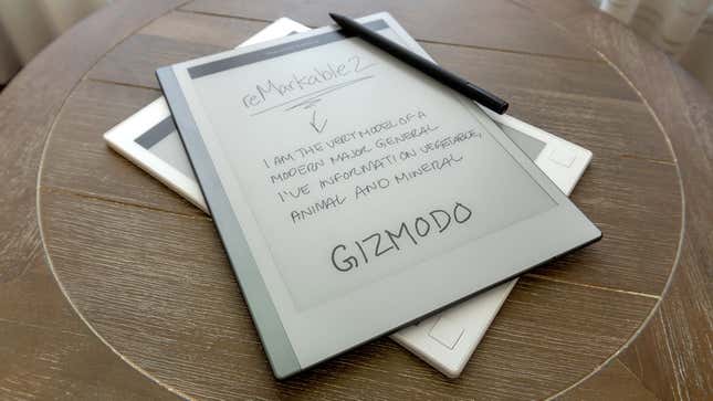 The reMarkable 2 sitting atop the original model on a small wooden side table.