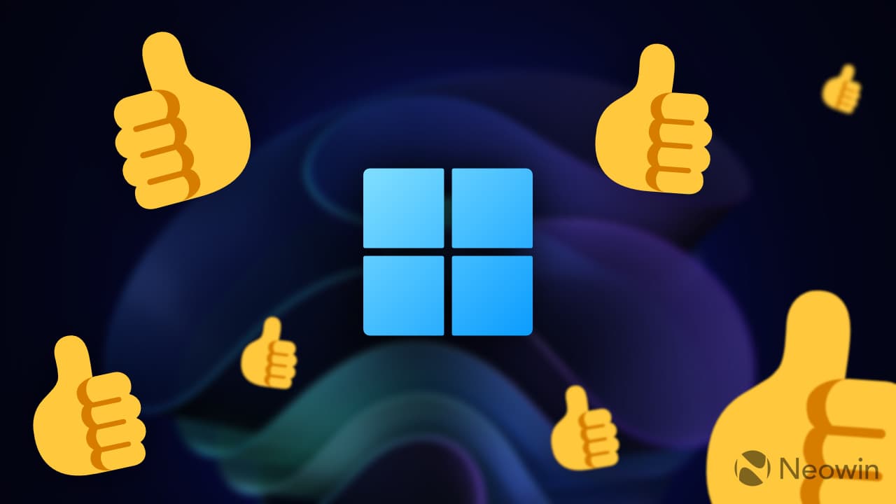 Ένα λογότυπο των Windows 11 που περιβάλλεται από emoji με τον αντίχειρα