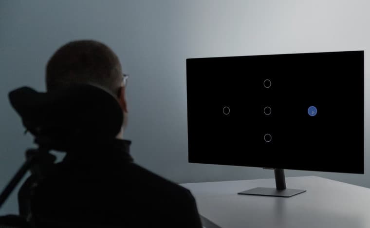 A man controlling a computer with his mind