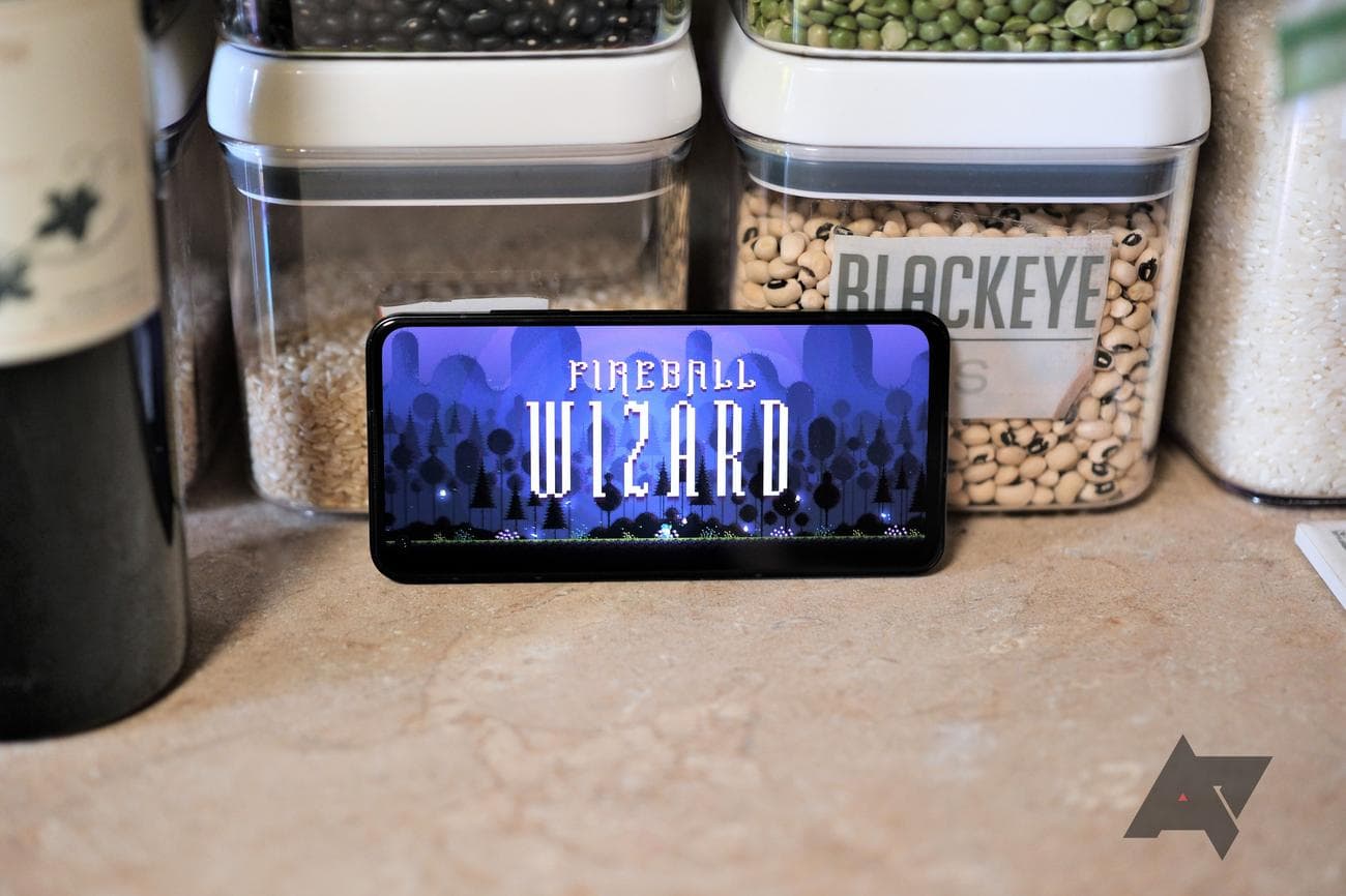 Asus Zenfone 10 standing sideways with a game on the screen