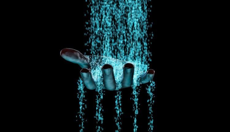 Hand with data streaming through it