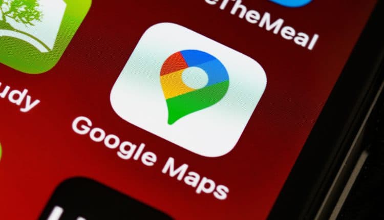 Edge of smartphone display with Google Maps icon in focus
