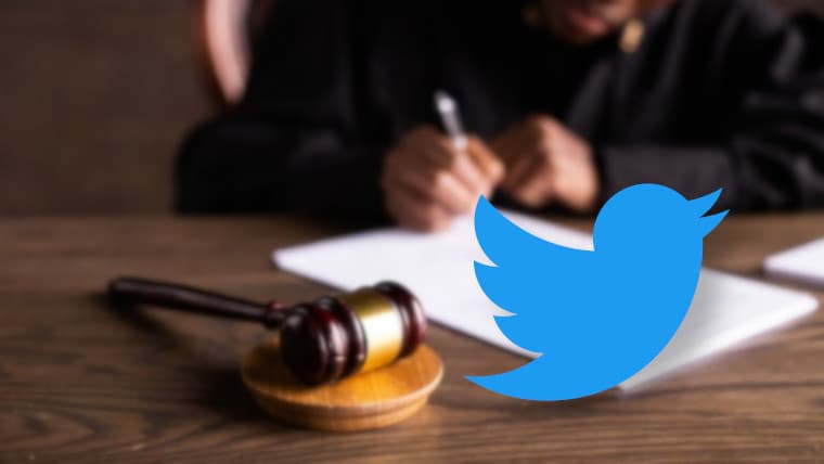 The Twitter logo in front of a gavel