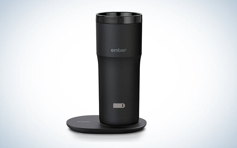 A black Ember smart mug on a blue and white background