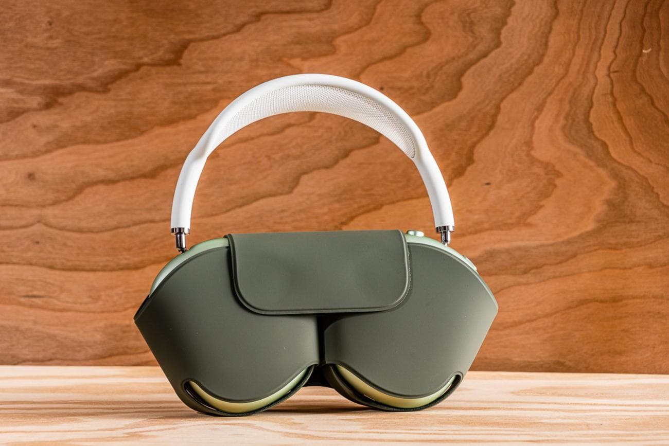 The Apple AirPods Max headphones in their gray, wraparound Smart Case.