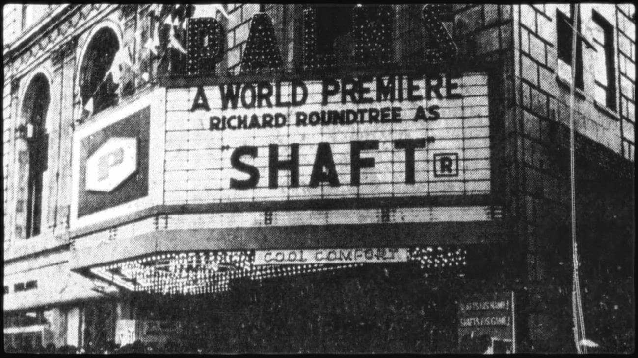 A black and white photo of a cinema showing the world premiere of 