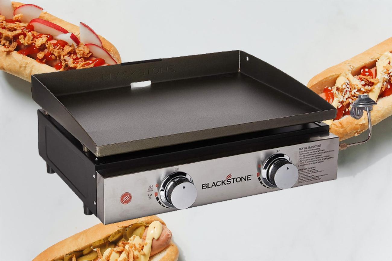 A Blackstone grill surrounded by hot dogs