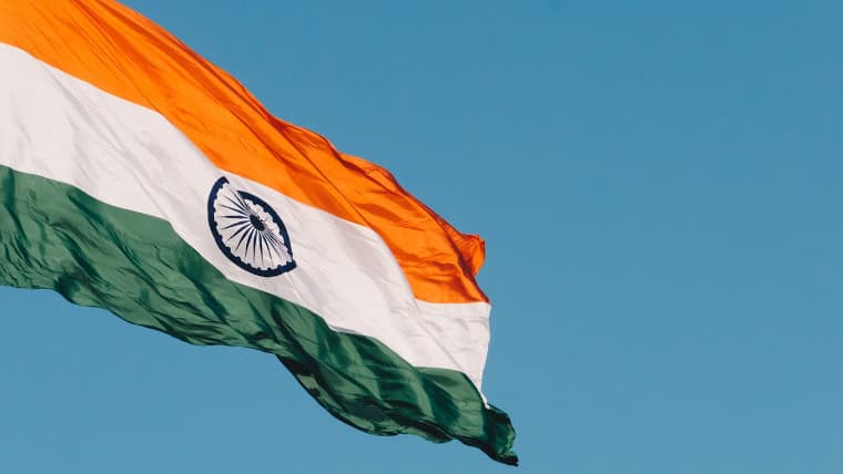 The Indian flag in front of a blue sky
