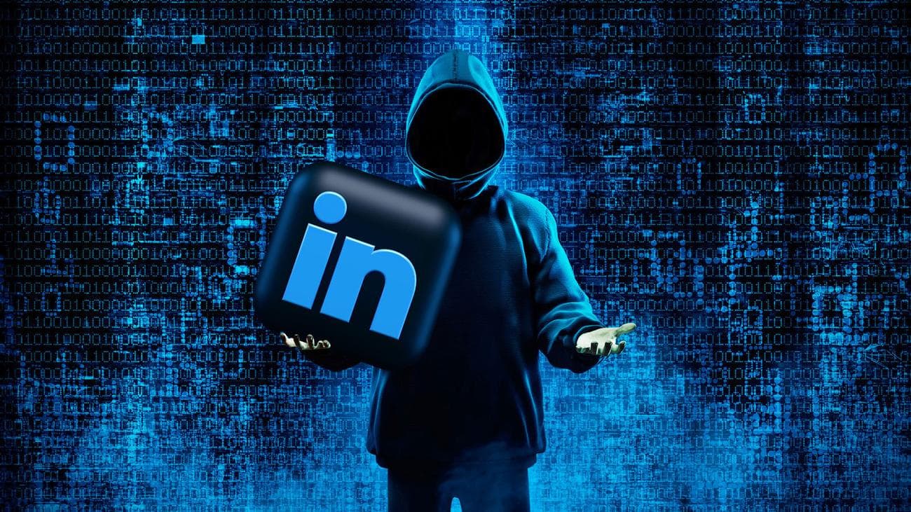 Hacker holding Linkedin logo
