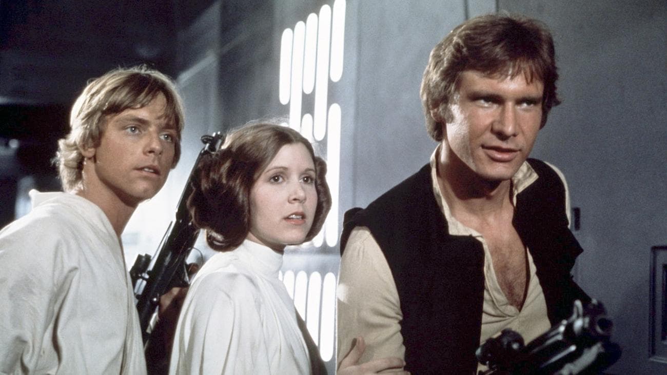 Actors Mark Hamill, Carrie Fisher, and Harrison Ford on the set of "Star Wars: Episode IV - A New Hope"