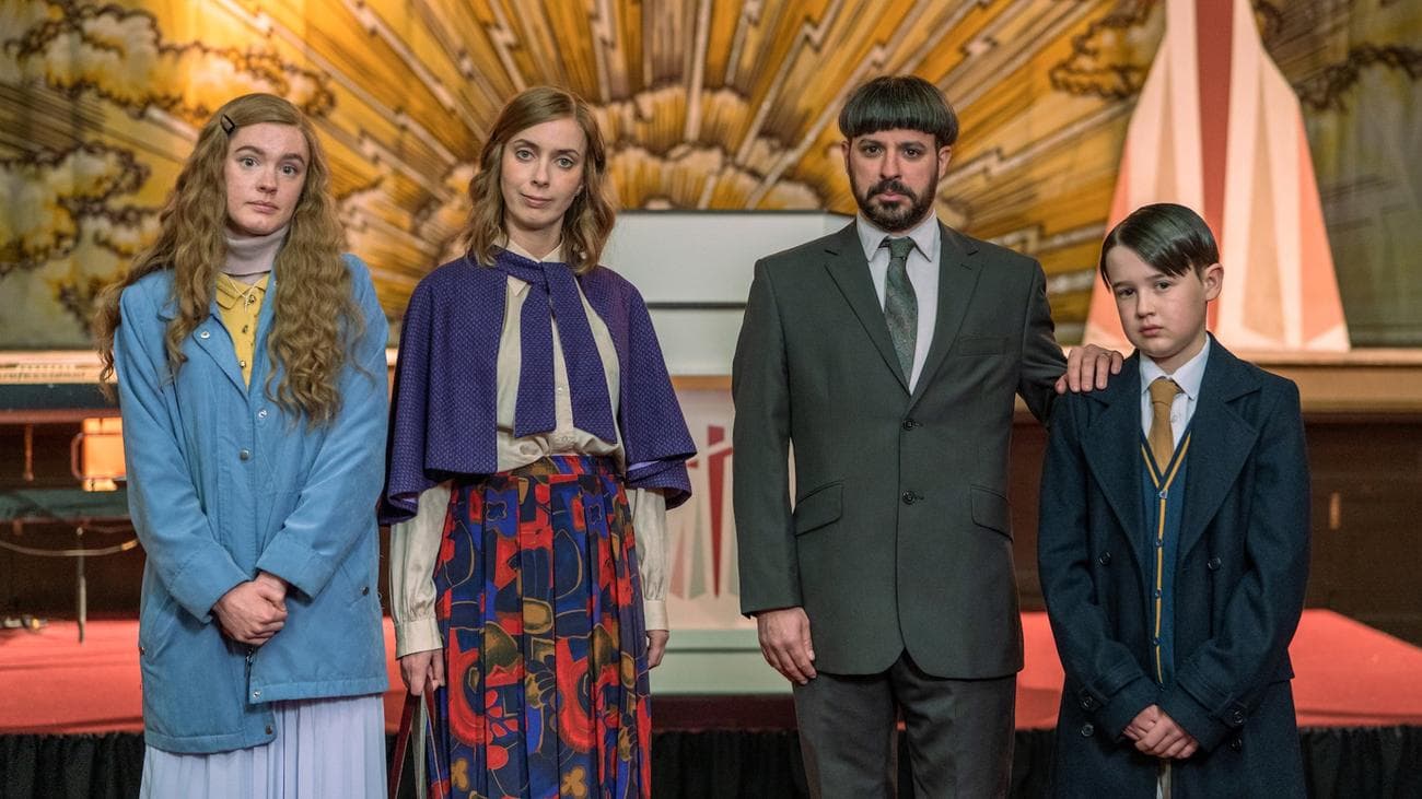 A family from a religious order stand in front of the altar in the show "Everyone Else Burns"
