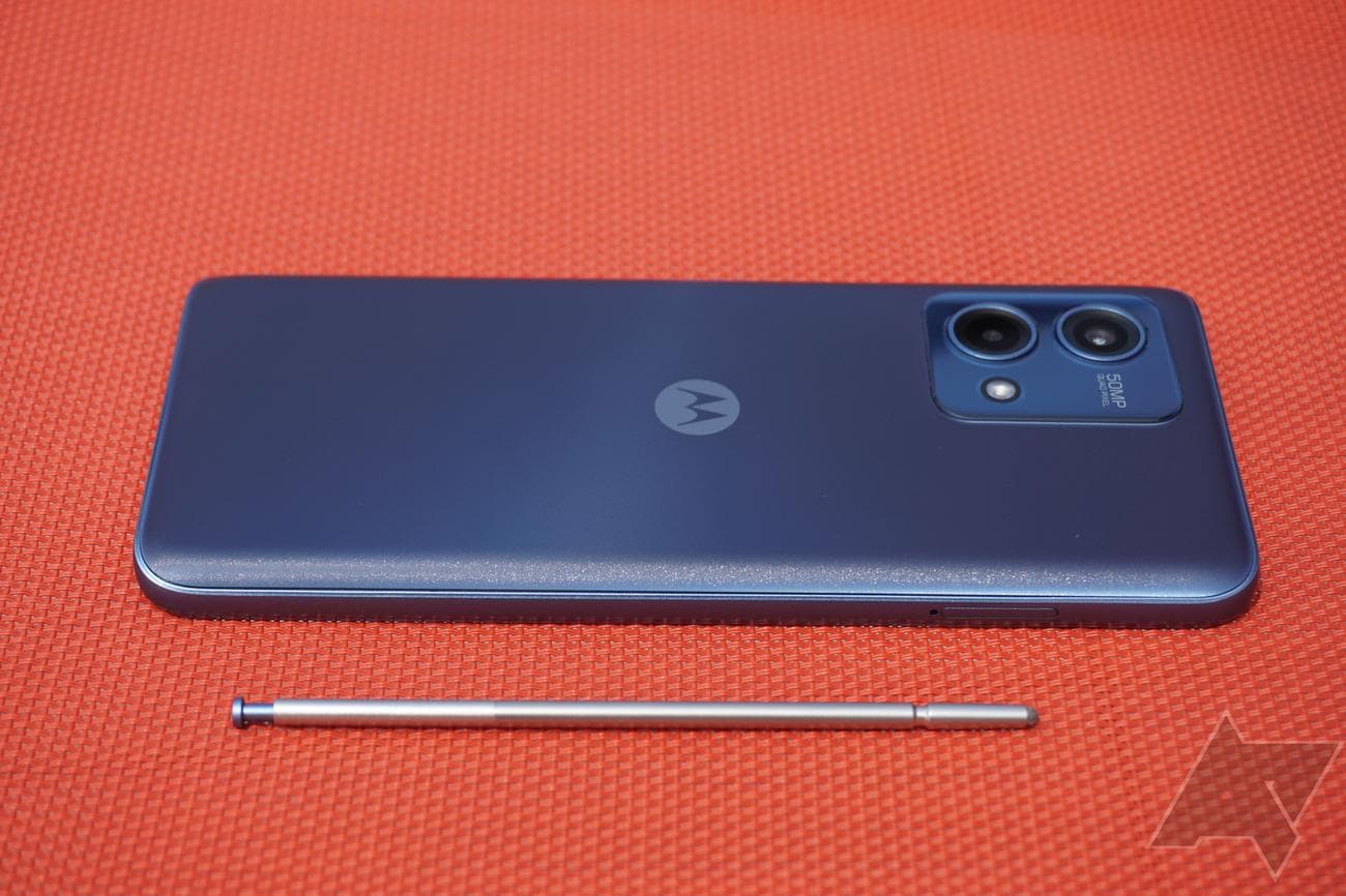 The back of the Moto G Stylus (2023) at a horizontal angle with the stylus next to it
