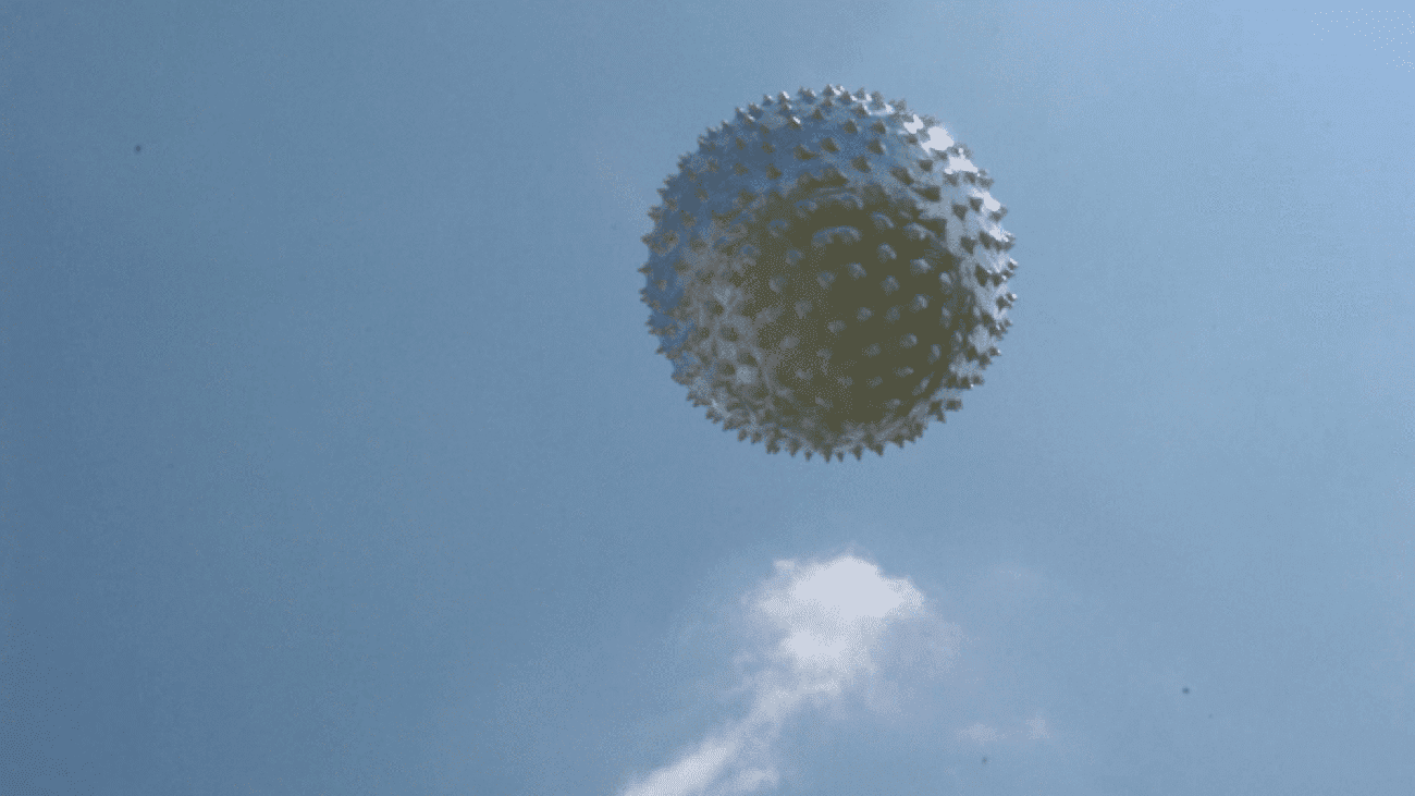 A weather balloon against blue sky
