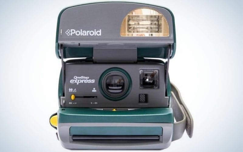 A small camera to take pictures which is classic with its camera lenses and all black color.