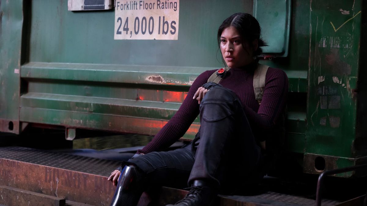 Maya Lopez sits on the edge of a train carriage in Marvel Studios