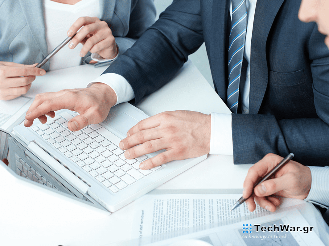 People surrounded by a keyboard.