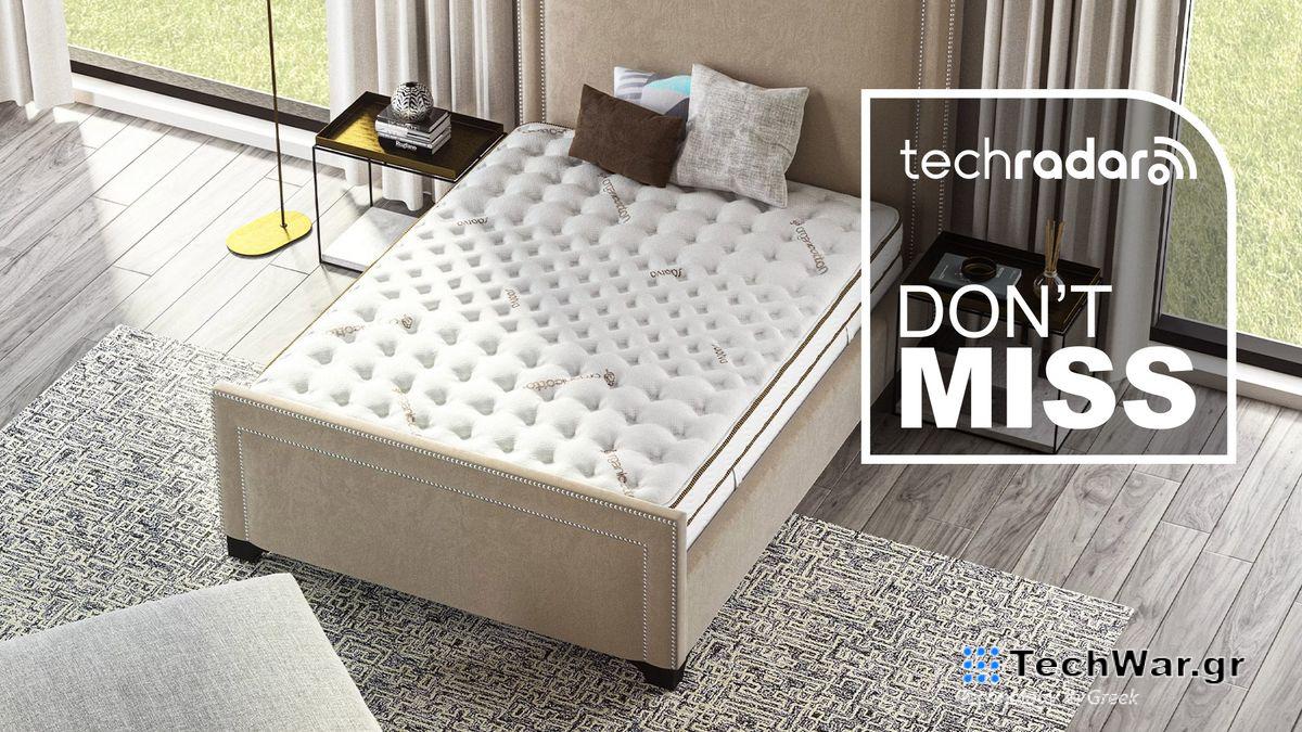 A Saatva Classic mattress in a bedroom, seen from above, with a badge saying "DON