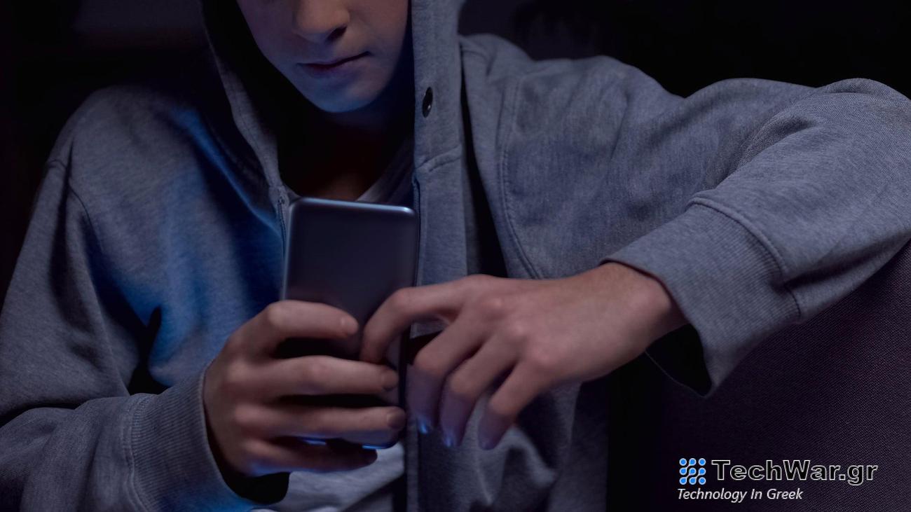 Teen using phone at night after curfew