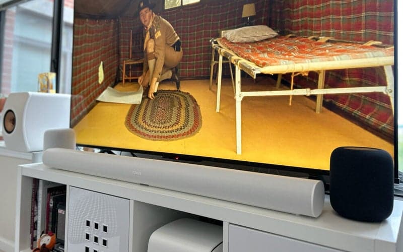 The best Sonos speakers in 2024 1 Sonos Arc soundbar in front of a TV flanked by HomePods