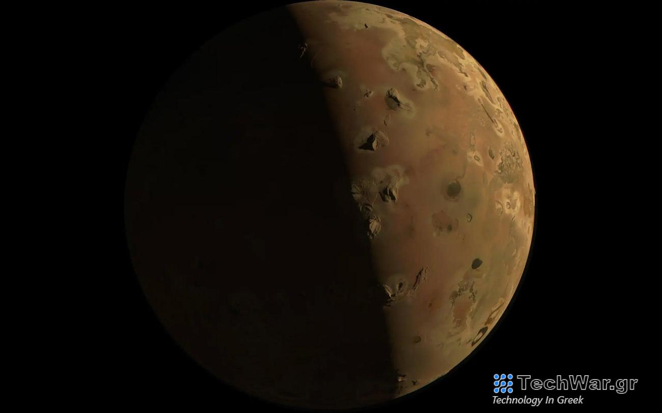 A reddish moon on a black background, dotted with several gray marks that are volcanoes. Jupiter's moon Io is one of Jupiter’s several moons. This image was taken on December 30, 2023 during the Juno spacecraft’s flyby of this volcanic Jupiterian moon.