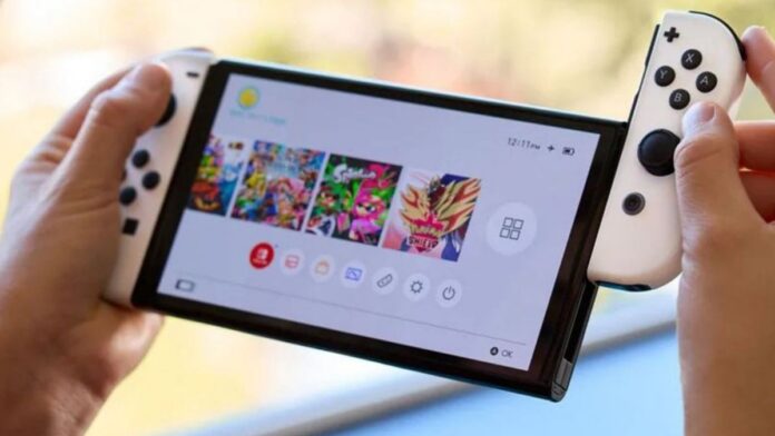 nintendo swithc oled with joy con being put in