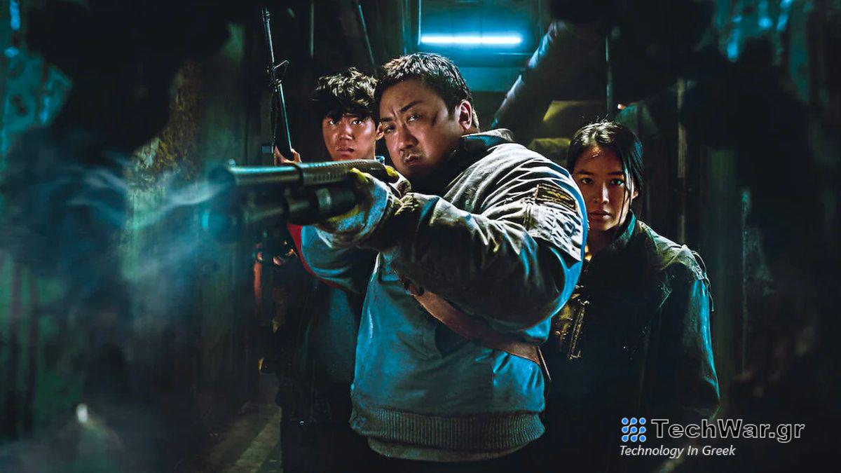 A still from Badland Hunters, Don Less is aiming a gun past the camera, with two young companions behind him