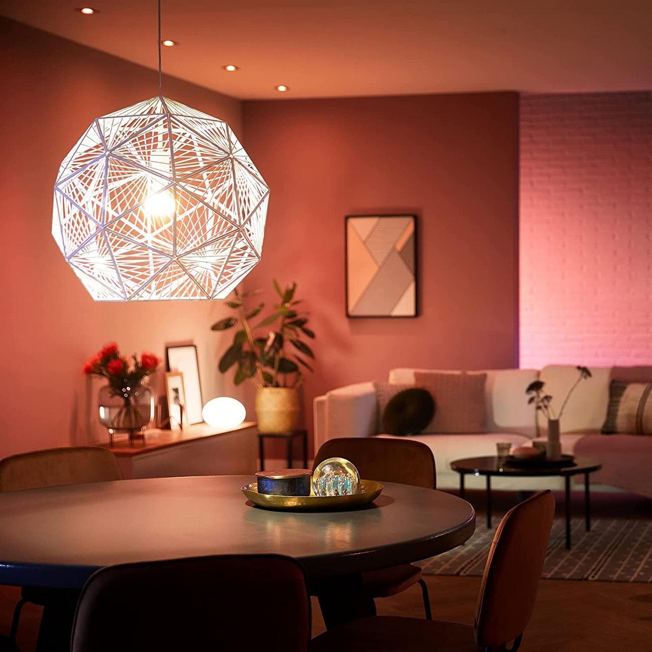 Philips Hue's A19 smart bulb lighting up a living room.