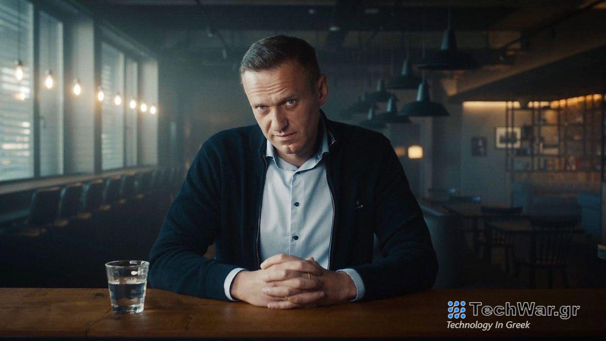 Alexei Navalny pictured looking pensive at a desk in a darkened industrial room in the Oscar-winning documentary movie simply titled Navalny.
