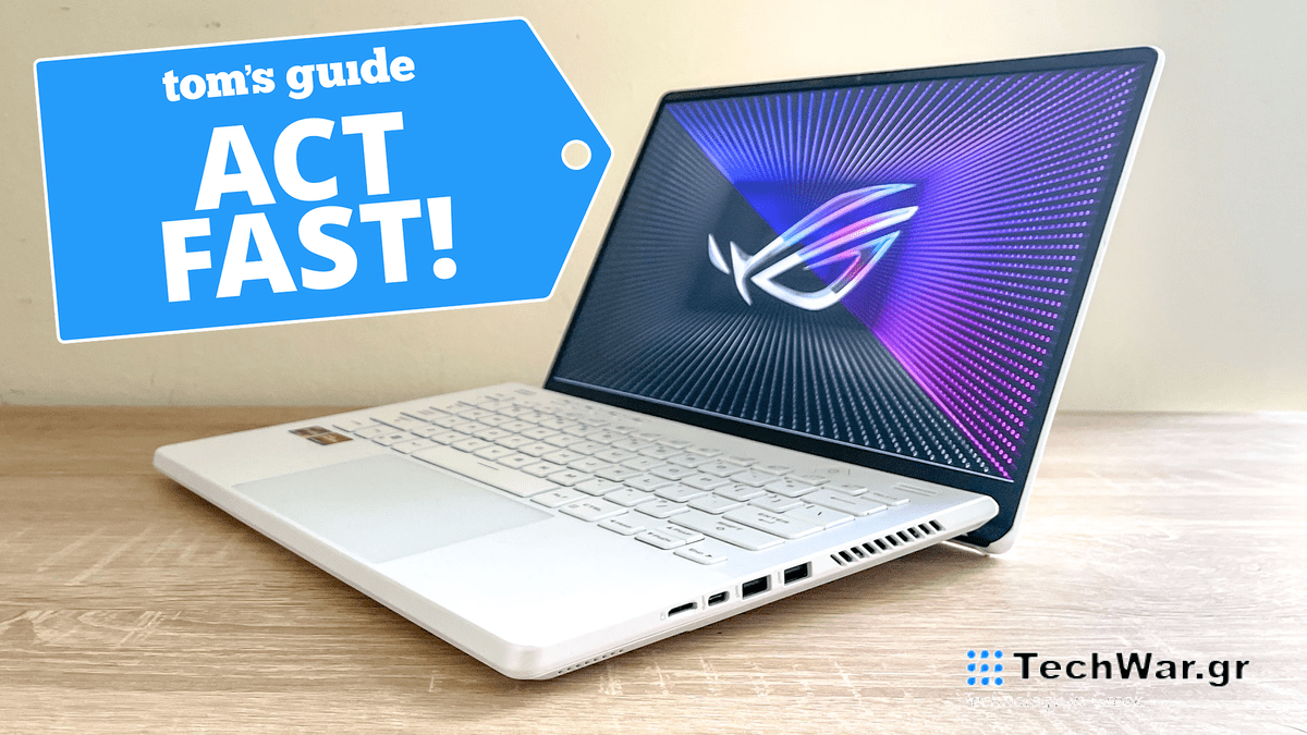 Asus ROG Zephyrus G14 on a desk with deal tag overlaid