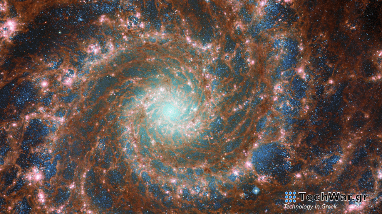 M74 aka the Phantom Galaxy shown in a combined optical/mid-infrared image, featuring data from both the Hubble Space Telescope and the James Webb Space Telescope. It is one of the celestial objects featured