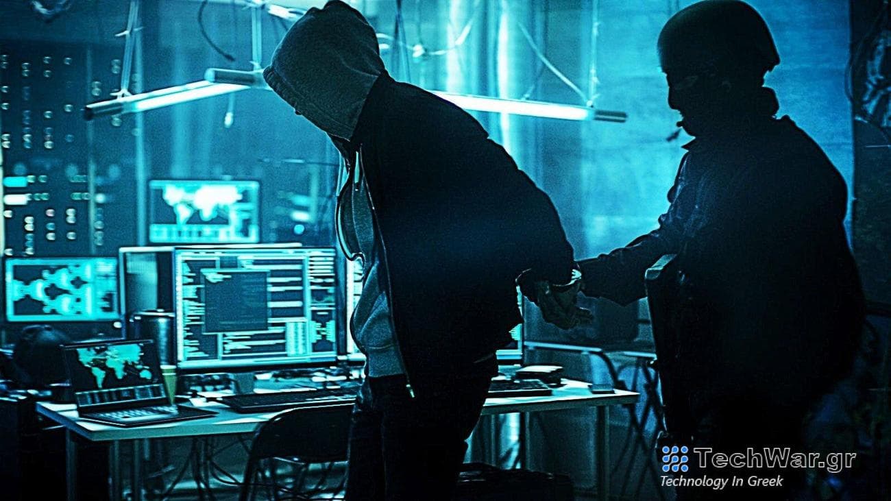 Police arresting cybercriminal