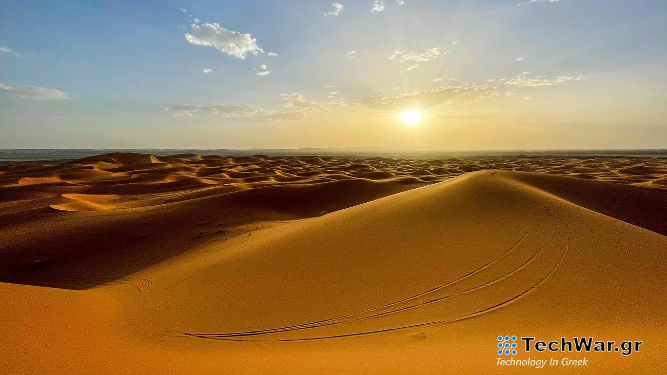 Sun rises over tall sand dunes. The Erg Chebbi region of the Sahara desert in Morocco. The region is home to the 984 foot tall Lala Lallia star dune.