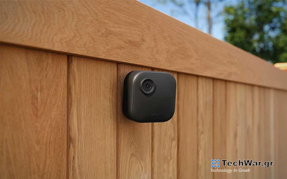 A Blink outdoor camera on a fence