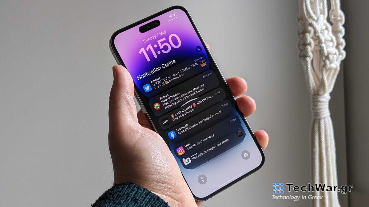 A person holds an iPhone 14 Pro in their hand.