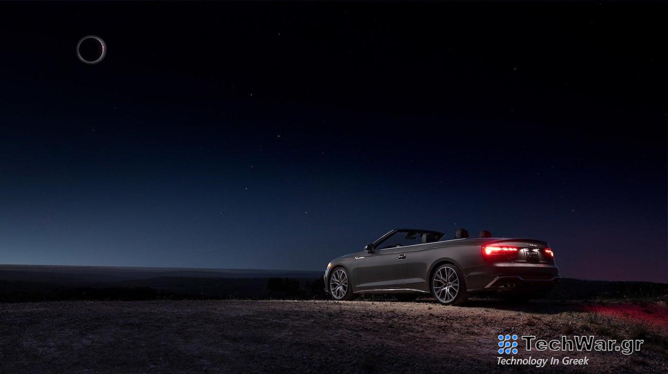 a convertible in blackness during the eclipse